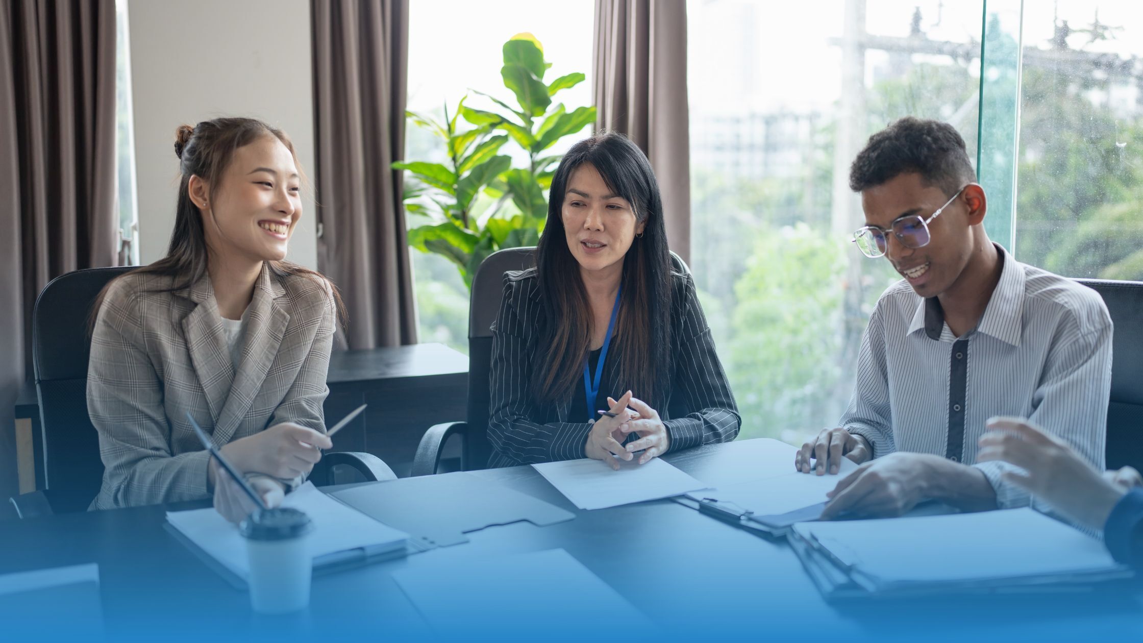 Business professionals reviewing contract data together to improve deal speed and decision making.