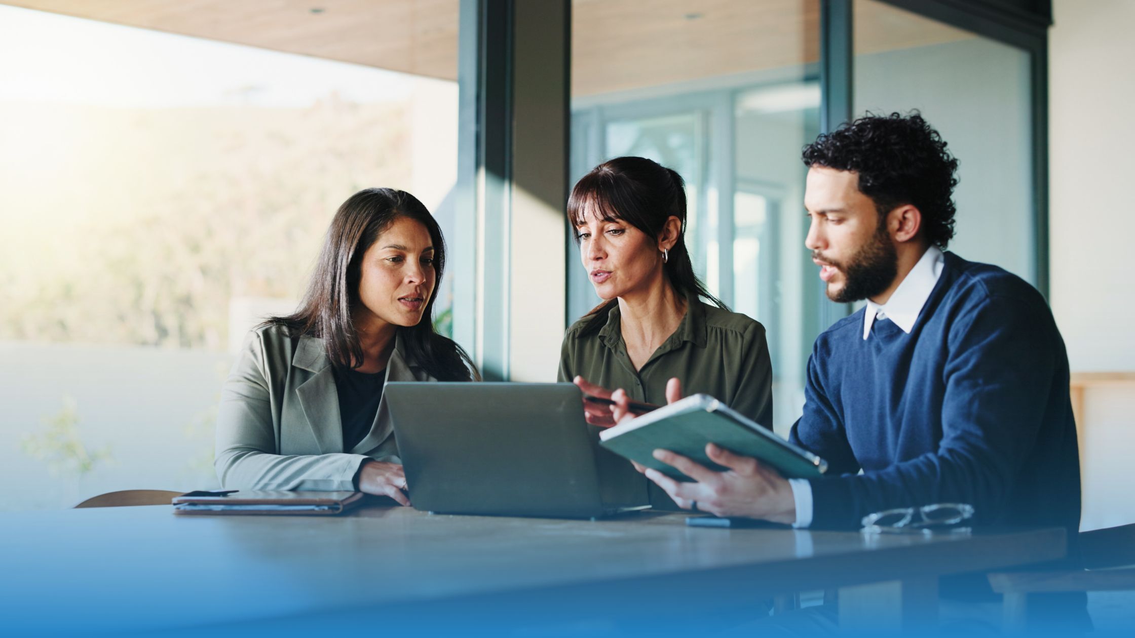 Team reviewing contract documents together to improve operational clarity and maintain trust at scale.