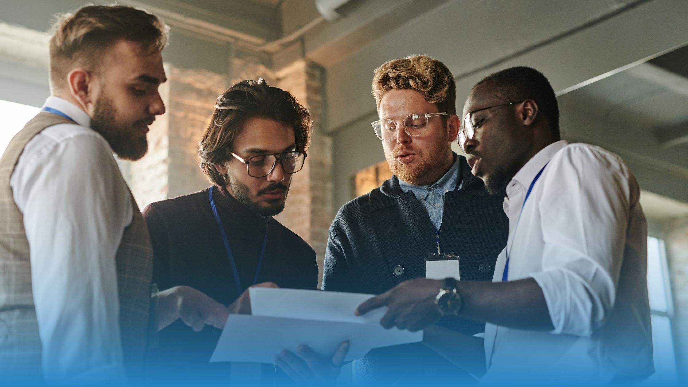 Business team reviewing contract documents to assess risk and decide which agreements require attention