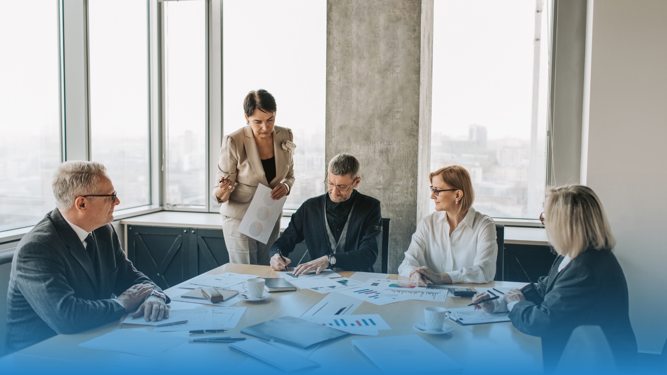 Business team analyzing contract data in December to improve clarity and reduce variance for the new year.