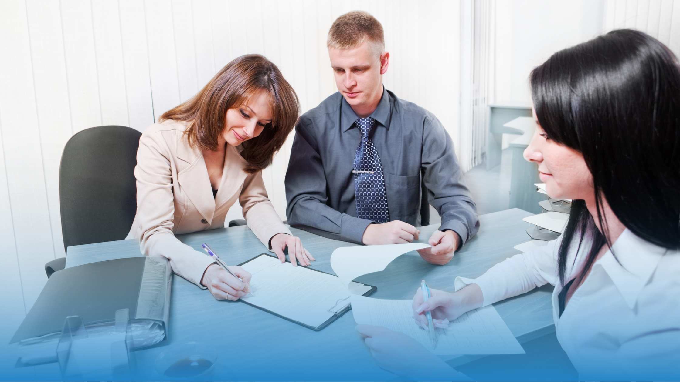 A group of three business people signing a contract representing how to speed contract signature