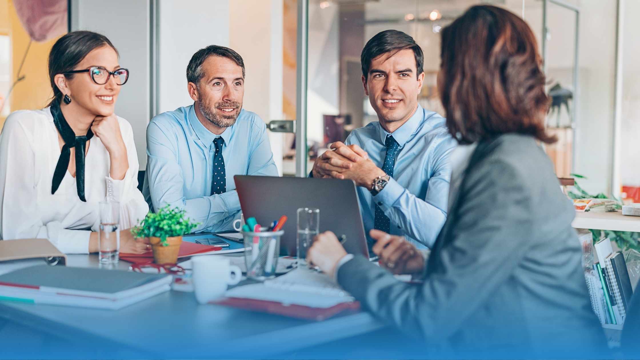 Four legal professionals discussing why contract management software is not enough for them